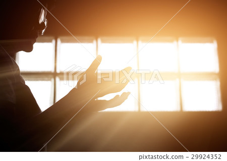 One respect and pray in room with sunrise through 29924352