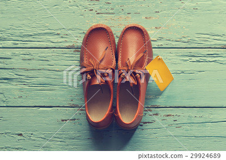 Vintage color style, Male shoes with tag on wooden 29924689