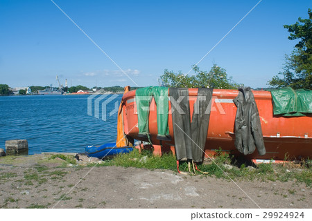 Fishing boat with wet sailor uniform. Baltiysk 29924924