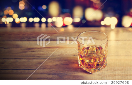 Whiskey drink on wooden background Whiskey drink on wooden background 29927698
