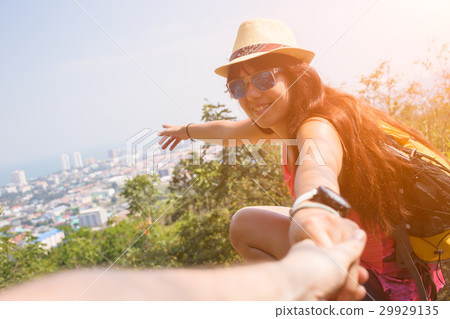 Woman pulls guy by hand Woman pulls guy by hand 29929135