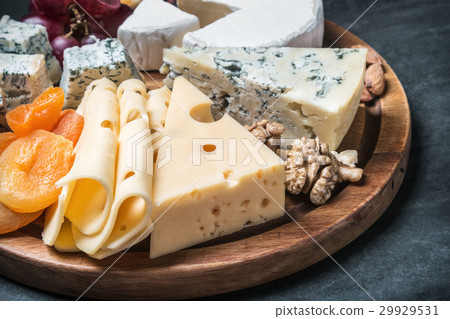 Assorted cheeses with grapes and nuts 29929531