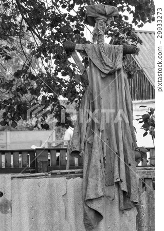 Old rural scarecrow outdoors, black and white 29933273