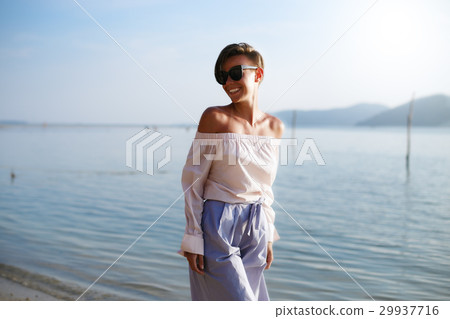 Sunny girl is posing on near the sea 29937716