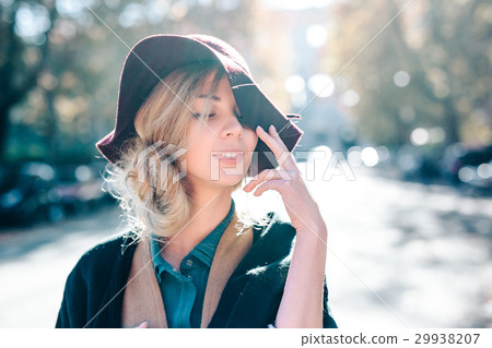 Blonde woman dreaming in hat closeaup fashion Blonde woman dreaming in hat closeaup fashion 29938207