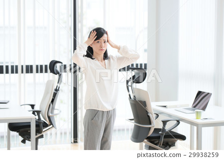 Business woman holding a head Business woman holding a head 29938259