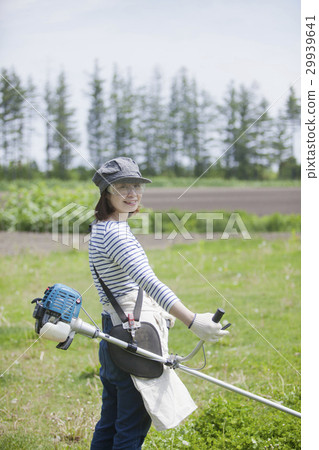 A woman working with mowing work 29939641