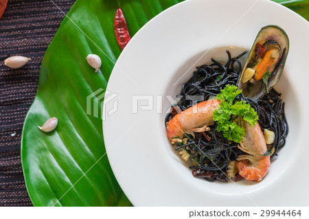 Black spaghetti with prawns on table.. Black spaghetti with prawns on table.. 29944464