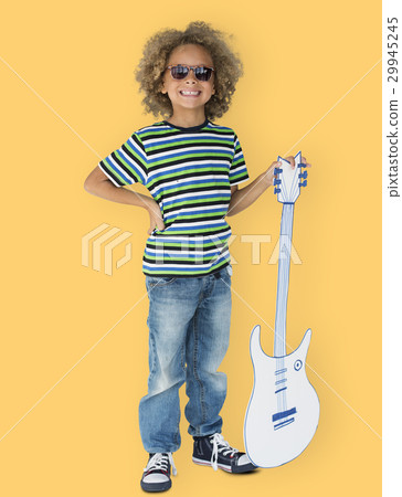 Portrait of a Little African Descent Boy with a Guitar Isolated 29945245