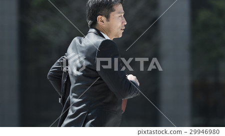 Middle businessman runs alone 29946980