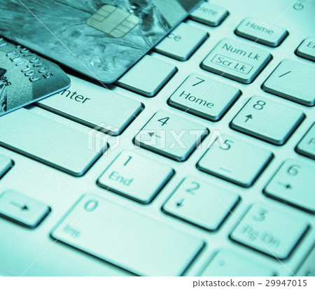 Credit cards on a laptop keyboard Credit cards on a laptop keyboard 29947015