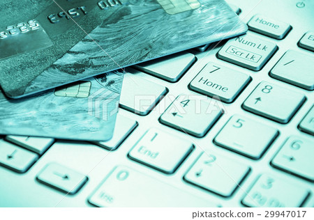 Credit cards on a laptop keyboard Credit cards on a laptop keyboard 29947017