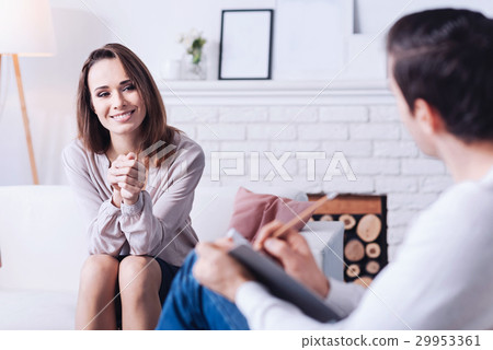 Cheerful delighted woman smiling 29953361