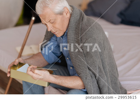 Sad depressed man looking at the photo 29953615