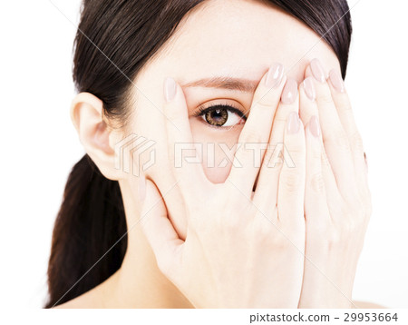 young woman covering her eyes by hands young woman covering her eyes by hands 29953664