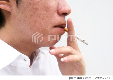 Man smoking a cigarette 29957755