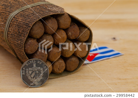Luxury Cuban cigars and money on the wooden desk 29958442