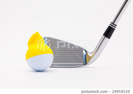 White golf ball with funny cap and golf club  29958520