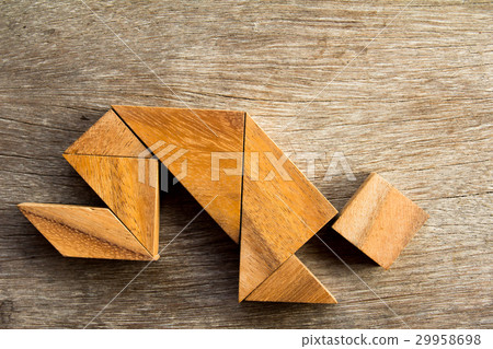 Wooden tangram puzzle in man crouch shape Wooden tangram puzzle in man crouch shape 29958698