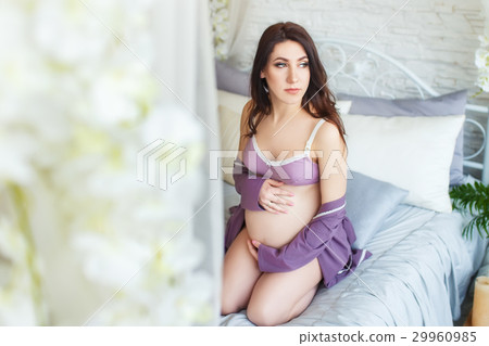 pregnant woman touching her belly pregnant woman touching her belly 29960985