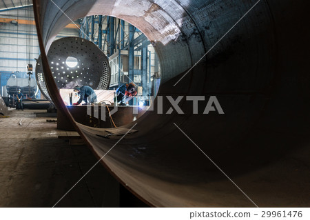 workers welding in a factory manufacturing boilers workers welding in a factory manufacturing boilers 29961476