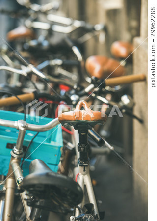 Leather saddle of bicycle parked in the street of Leather saddle of bicycle parked in the street of 29962288