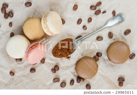 Multicoloured macaroons and coffee Multicoloured macaroons and coffee 29965011