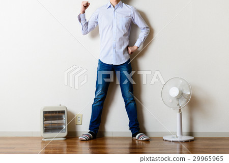 Fan and electric stove, standing man 29965965