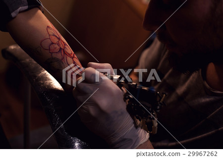 Tattoo artist works in salon 29967262