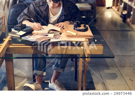 Asian student boy studying in school library Asian student boy studying in school library 29973446