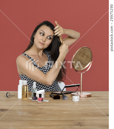 Elegance woman wearing makeup herself Elegance woman wearing makeup herself 29975290