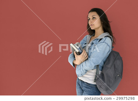 Girl student is carrying books and backpack Girl student is carrying books and backpack 29975298