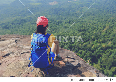 woman hiker enjoy the view hiking on mountain peak woman hiker enjoy the view hiking on mountain peak 29976017