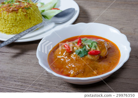 Chicken massaman curry with cooked turmeric rice Chicken massaman curry with cooked turmeric rice 29976350