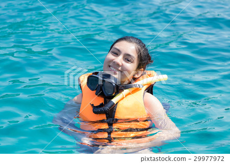 Beautiful woman snorkeling Beautiful woman snorkeling 29977972