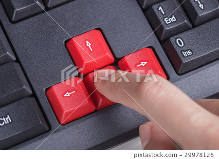 finger pushing arrow button on keyboard computer finger pushing arrow button on keyboard computer 29978128