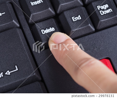 finger pushing delete button on keyboard finger pushing delete button on keyboard 29978131