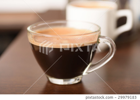 Cup of coffee on wooden table 29979183
