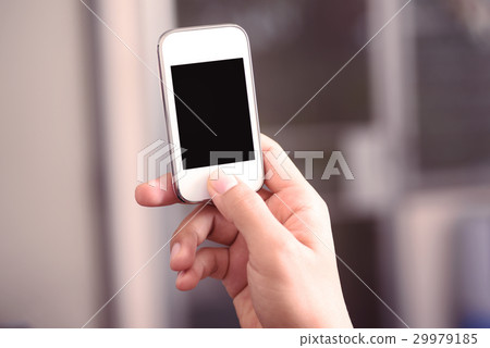 Hand holding smart phone with blank screen Hand holding smart phone with blank screen 29979185