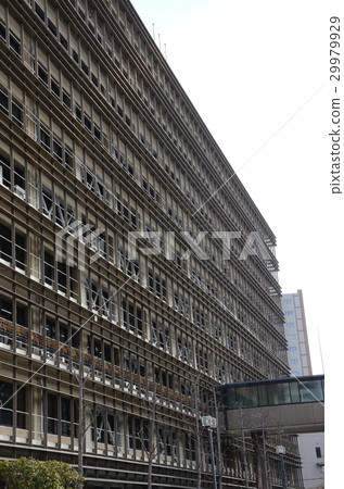 A characteristic exterior building covered with a metal louver / metal louver board 29979929