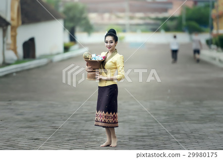 Asian woman in silk dress in temple 29980175
