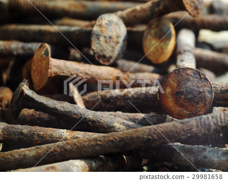 group of old rusty nuts and bolts on the floor group of old rusty nuts and bolts on the floor 29981658