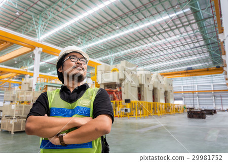 Portrait of an handsome engineer in a factory Portrait of an handsome engineer in a factory 29981752