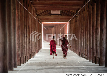 Back side of Buddhist novice are walking in pagoda 29982564