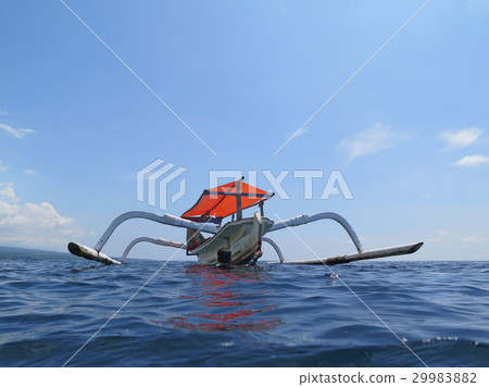 Traditional fishing boats floating on the sea Bali 29983882