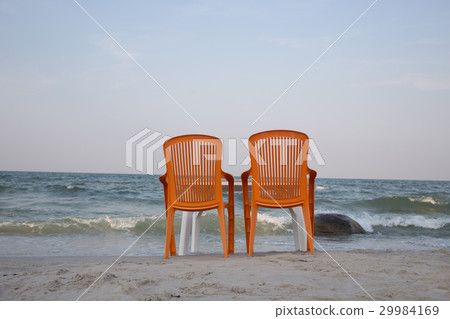 Two sun loungers on seashore Two sun loungers on seashore 29984169