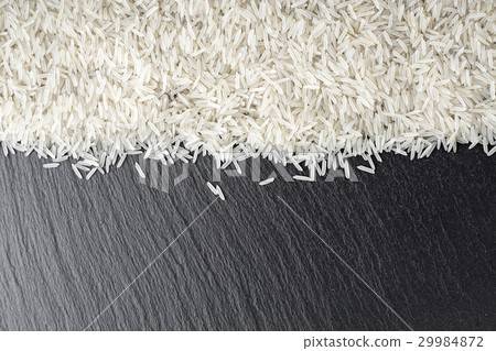 rice scattered on the black background rice scattered on the black background 29984872