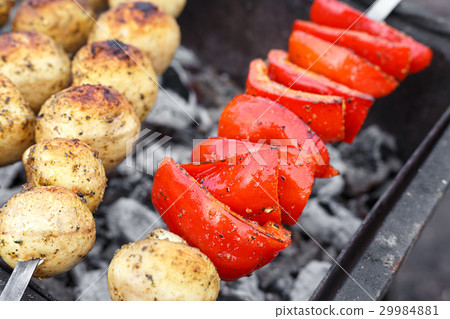 Vegetables on skewers on a grill 29984881