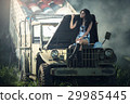 Asian model posing with old truck in an outdoor  29985445