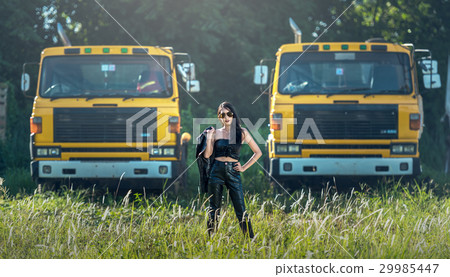 Asian model posing with truck in an outdoor  29985447